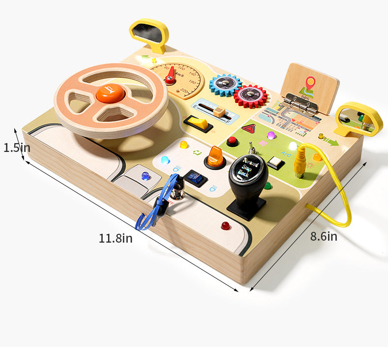 A toddler playing with a wooden steering wheel busy board, featuring realistic buttons, gears, and colorful letters on the back.