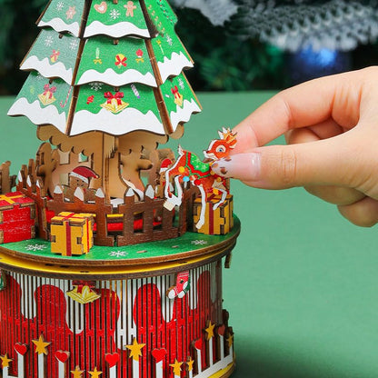 The assembled wooden music box displayed as a charming holiday decoration in a cozy home setting