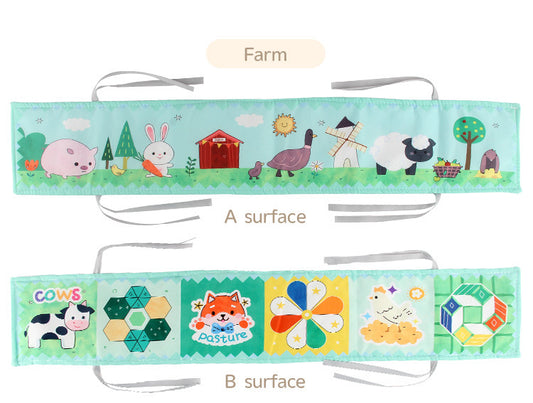 Newborn baby looking at a double-sided contrast book attached to the crib for visual development