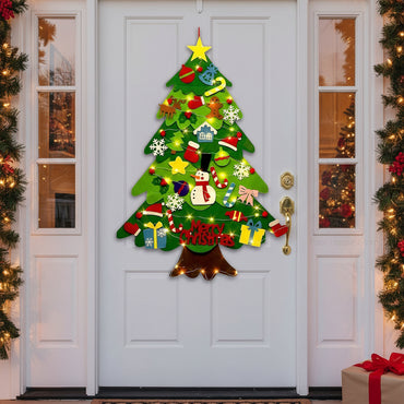  A joyful child hanging DIY Christmas ornaments on the tree, enjoying creative play with our kid-friendly decoration set.