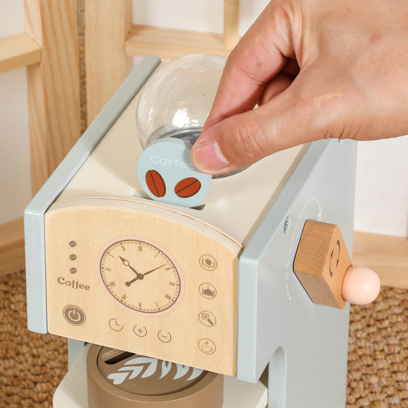 Toy espresso machine with pressable milk frother and wooden coffee pods