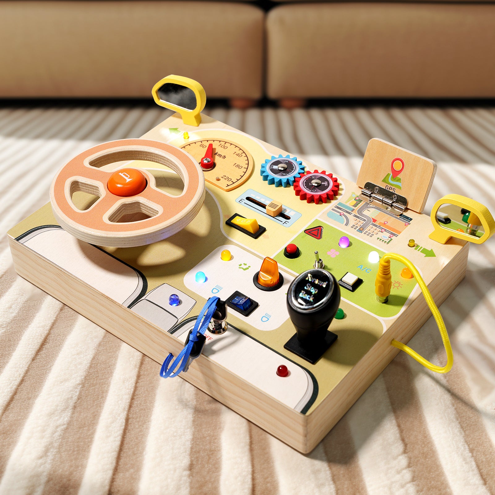 A toddler playing with a wooden steering wheel busy board, featuring realistic buttons, gears, and colorful letters on the back.
