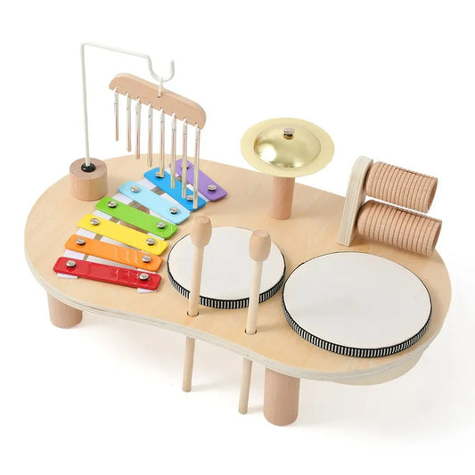 Wooden all-in-one music discovery center featuring xylophone, chimes, and drums for toddlers.